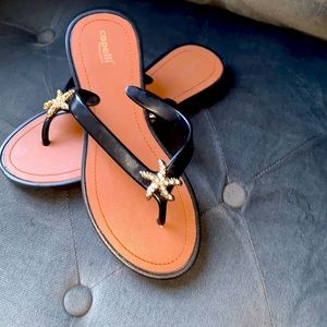 Flip flops in black bedazzled starfish